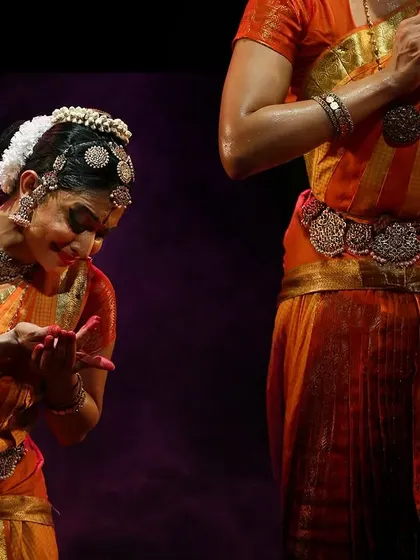 A moment of interaction between two performers in *Sarvasya*. The connection can be seen in the mirroring of gestures and the shared focus.