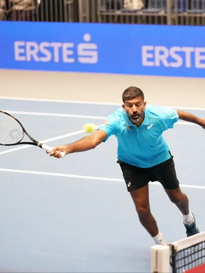 A low volley at the net, a shot that requires quick hands and great touch.