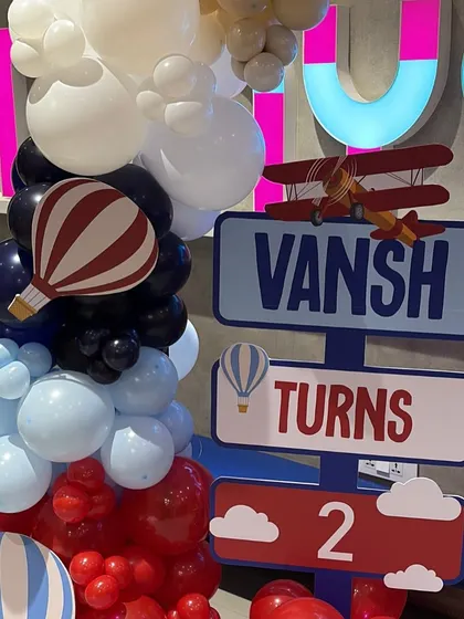 A themed directional sign for the "Time Flies" party, guiding guests through the celebration with fun, personalized details.