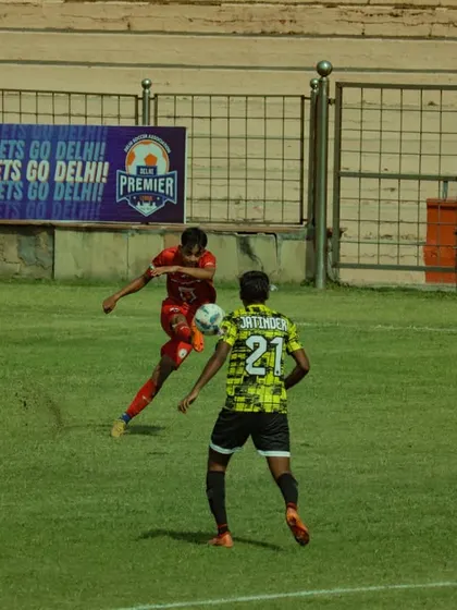 A player strikes the ball on the volley, a difficult technique that requires perfect timing and coordination. We train our players to be technically proficient in all areas.