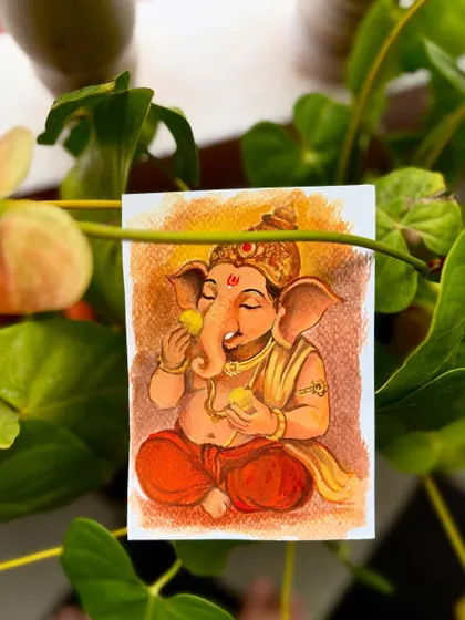 The Ganesha enjoying a ladoo painting, also placed in a natural, green environment.
