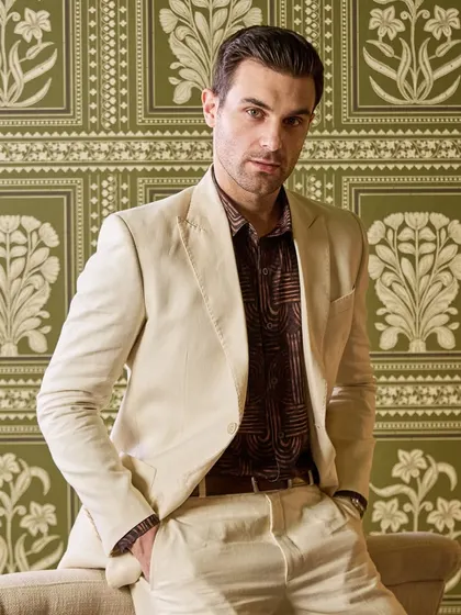 Comfort and style, rolled into one. This ivory linen suit is a testament to my belief that you should never have to compromise on either.