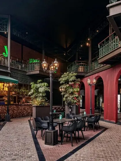 Another view of the courtyard at Street 1522, showing how the placement of planters and vintage-style street lamps helps to frame different seating areas and guide the flow of foot traffic through the space.