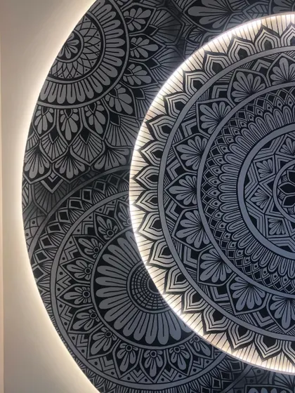 A detailed shot of the backlit mandala, focusing on the crisp lines and the soft glow of the hidden LEDs.