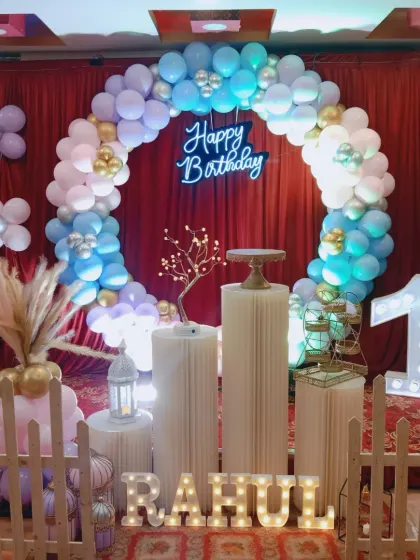 The full setup for the at-home first birthday, showing how all the elements come together to create a festive stage.