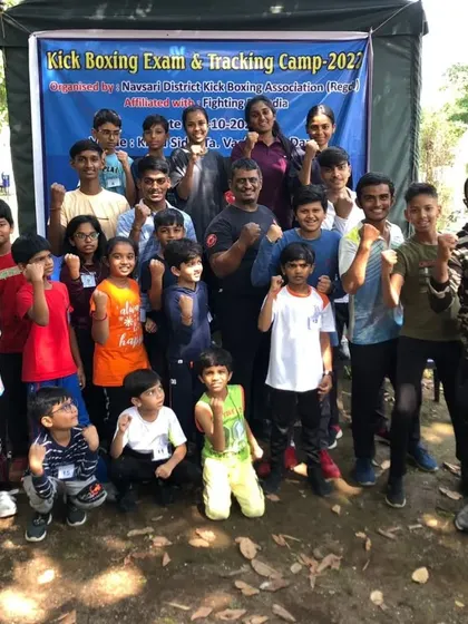 A group photo with the kids after their kickboxing exam. Their energy and enthusiasm is amazing.