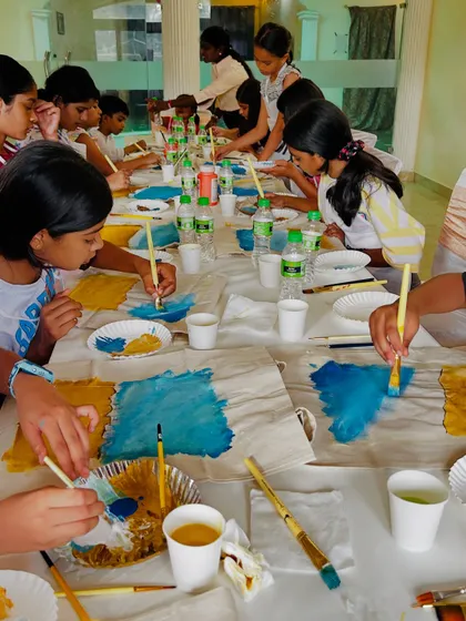 Another angle from our Delhi kids' tote bag workshop. The long table setup is perfect for a group activity.