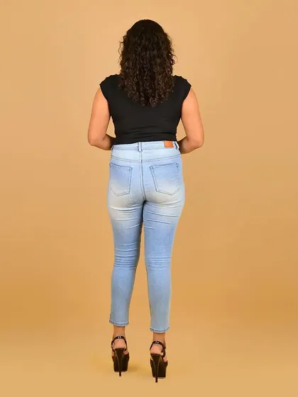 The standard back view for her portfolio, showcasing her hair and physique.