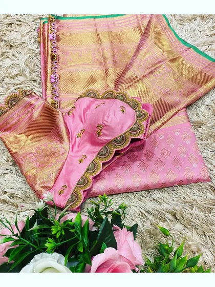 Another angle of the pink saree and blouse set, highlighting the intricate hand-krosha tassels.
