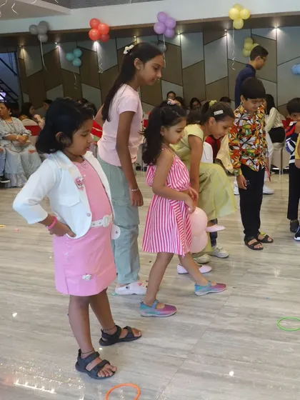 A balloon race in progress. Simple props can create the most exciting and memorable party games for children.