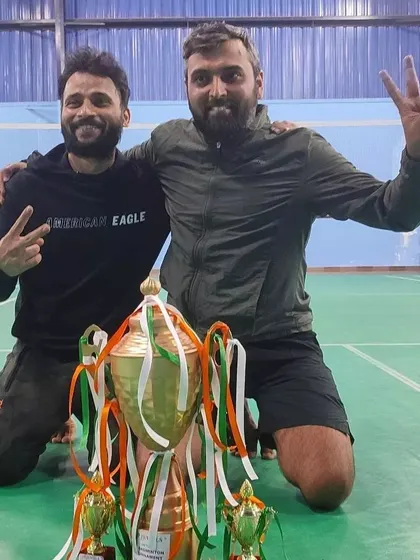 A moment of celebration for our adult doubles champions on the court.