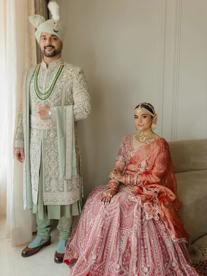 A portrait of modern royalty. Sakshi and Arpan's coordinated outfits and poised grace made for a stunning, regal photograph.