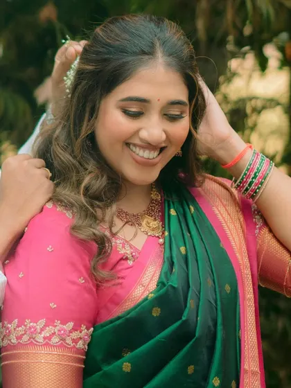 A beautiful Maharashtrian bride during her engagement ceremony. The makeup is traditional yet fresh, with soft eyes and a smile that lights up the frame.