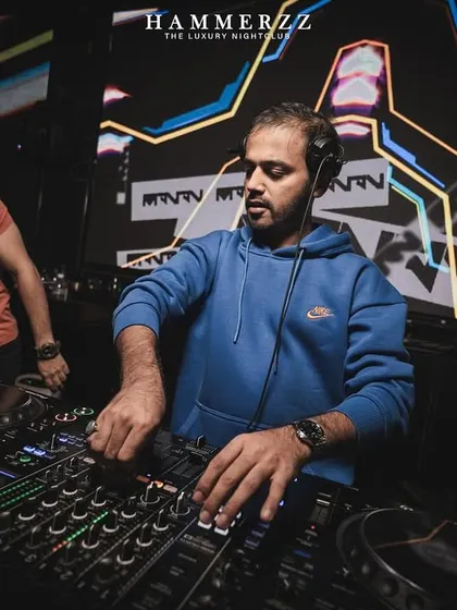 A close-up of me at Hammerzz, dialing in the mix with intense focus.