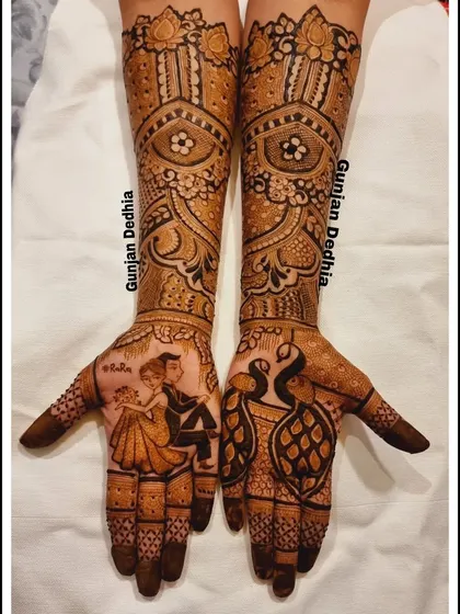 A clear shot of the engagement mehendi for my client Ravina, showcasing the dancing couple and peacock motifs.