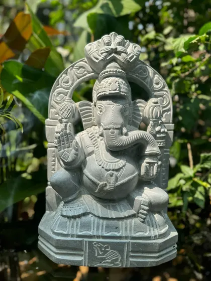 This Ganesha statue, with its intricate arch and the small mouse at its base, is a perfect example of our detailed carving work.
