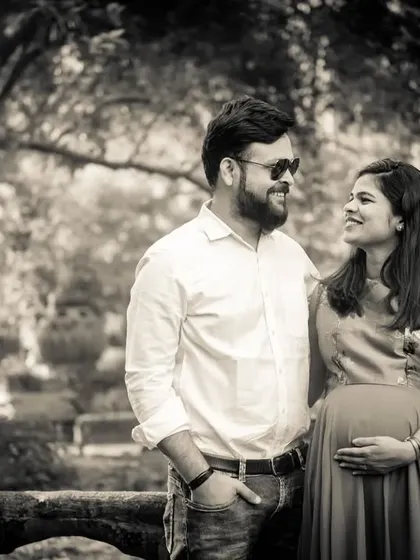 A classic black and white portrait of an expecting couple. The simplicity of the color palette puts all the focus on their expressions and the special bond they share.