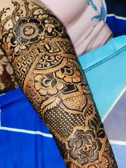 A close-up of the intricate patterns on the forearm, highlighting the precision and skill involved.
