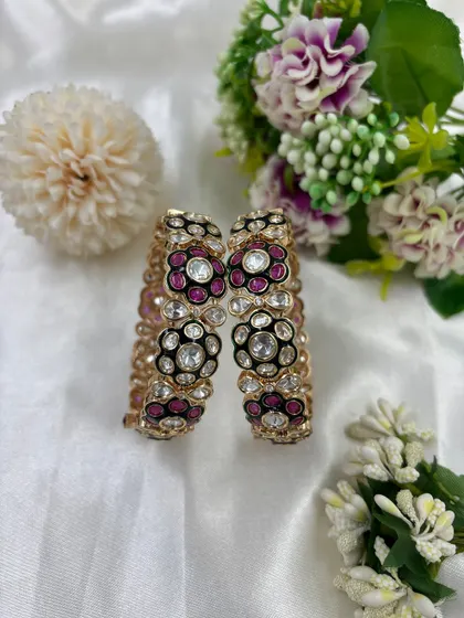 A close-up of the Gulzar Mina Kari Moissanite Kundan Bangles. This image highlights the rich ruby-colored Meenakari and floral design.