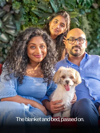 This family portrait, with their beloved dog held close, is a beautiful reminder of the memories we create. One day, these are the moments you'll cherish the most.