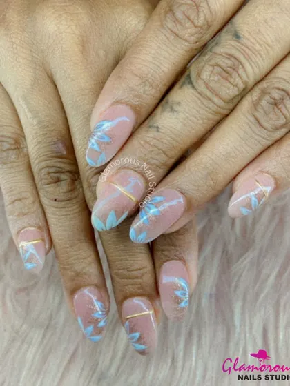 This design is all about understated elegance. On a clean, nude base, we hand-painted delicate, leafy branches in a soft baby blue, with a thin gold line adding a touch of modern sophistication.