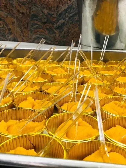 This is a classic Indian sweet, possibly a rich halwa, presented in elegant golden cups for easy serving at a buffet. I focus on both taste and presentation to ensure the dessert course is a highlight of your event.