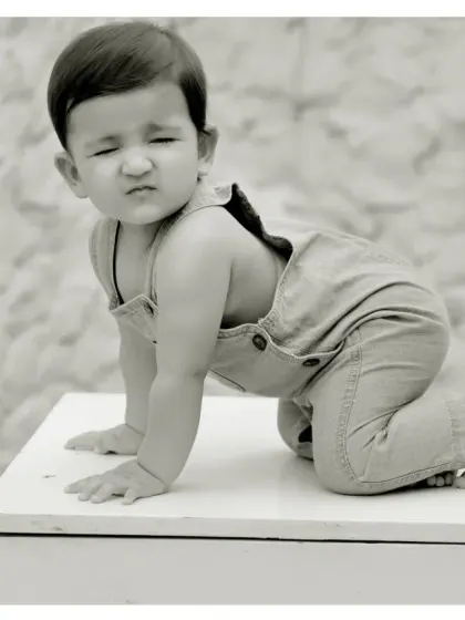 A funny face captured in a timeless black and white photo. Sometimes the most playful moments make the best memories.