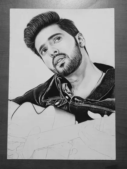 Follow the 90-hour journey of my Armaan Malik portrait. These progress shots show how I use the grid method to ensure accuracy and build up the face, hair, and clothing textures.