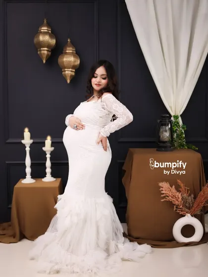 Another gorgeous solo pose in the white lace gown. This shot beautifully captures the graceful curve of the baby bump.