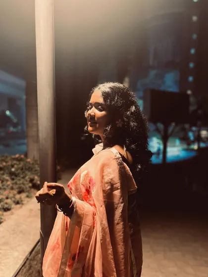 Another angle of my floral saree look, perfect for a festive wedding performance.