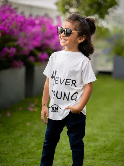 "4ever young" indeed. This stylish four-year-old looks right at home in this cool and casual outdoor portrait.