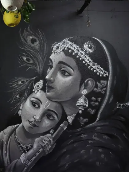 A straight-on shot of the completed Krishna and Yashoda mural. The black background makes the white and grey figures stand out, giving the piece a timeless, portrait-like quality.