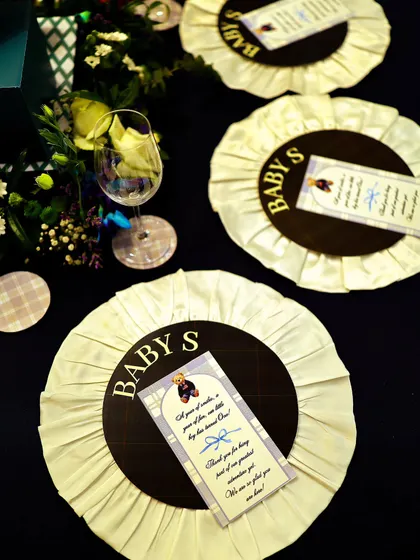 Custom-made rosettes served as unique place cards and party favors. This detail, inspired by equestrian awards, was a perfect nod to the 'Polo Club' theme and a delightful keepsake for guests.