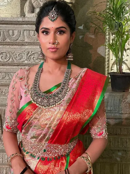 A close-up against a traditional backdrop, highlighting the beauty of the entire ensemble.