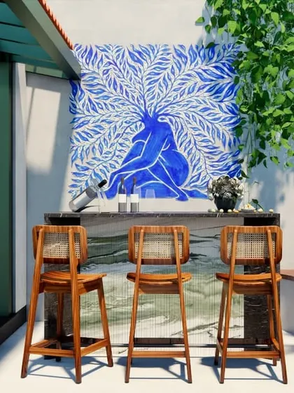 A vibrant, custom-painted mural serves as the backdrop for the bar area on the HAUS 5 terrace, adding a splash of color and personality to the outdoor space.