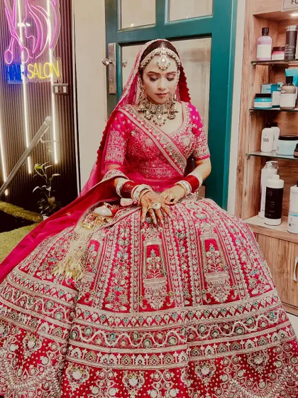 A full-length view of our Sikh bride, showing how the makeup, hair, and magnificent lehenga come together. We ensure every element, from the maang tikka to the bangles, is perfectly in place.