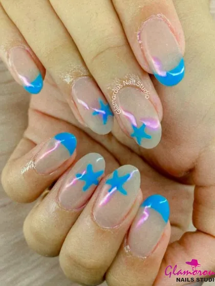 A fun and graphic design featuring bright blue French tips and matching blue stars on the accent nails, all on a natural, sheer base.