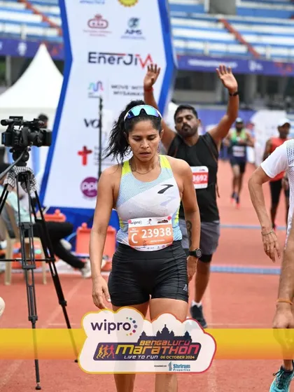 Exhausted but triumphant after crossing the finish line. This moment is a culmination of months of hard work. I'm there to guide you through every step of that journey.