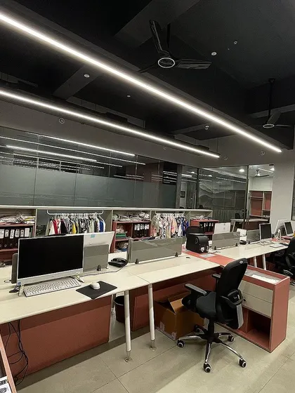 The workstations at VEE CEE EXPORTS are designed for collaboration and efficiency, with ample storage and clean lines.