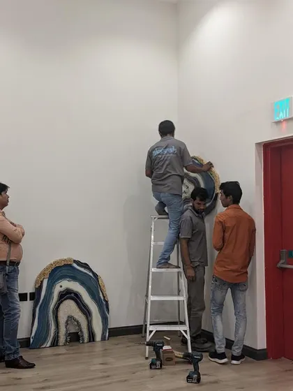 The installation process for my geode art. From the studio to the wall, my team and I ensure every piece is handled with care and installed securely.