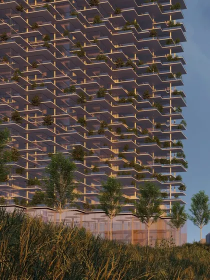 The "Villas in the Sky" tower is designed to feel like a natural extension of the landscape. The building rises from a bed of wild grasses, and its facade is a vertical garden, blurring the line between the built environment and nature.
