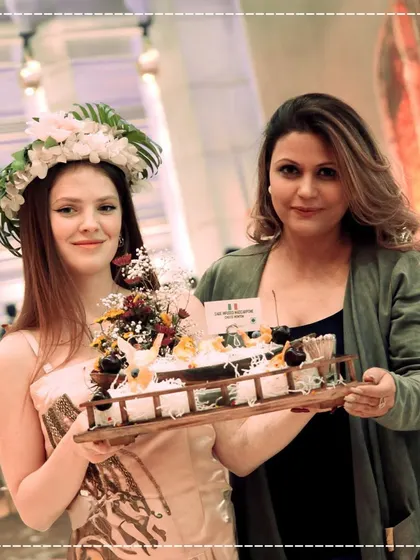 Our celebrity food stylist, Sakshi Tuli, with a model presenting one of our unique sushi platters. She is redefining hospitality with her innovative presentations and personal touch at events.