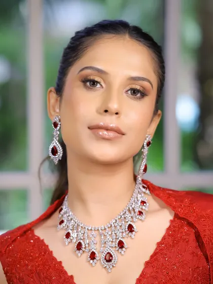 Embracing elegance in red. This close-up shows the soft bronze eyes and flawless base that I created for this glamorous cocktail look.