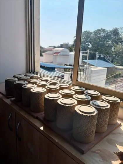 These carved tumblers were also part of the Lagavi collection, drying on the studio window sill before being fired.