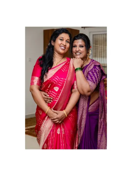 Another picture with my dear sister during Diwali. We are both wearing sarees with custom blouses I designed.