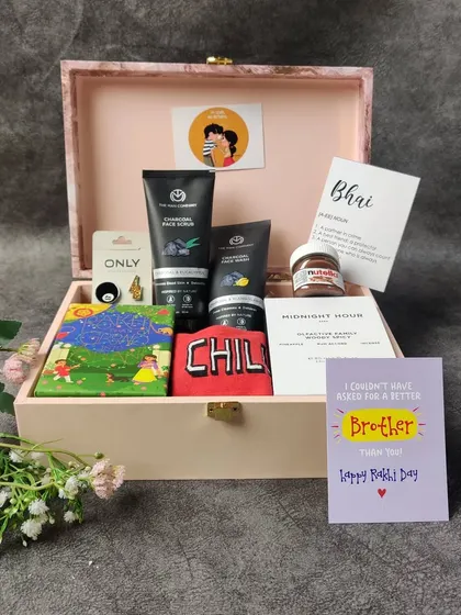 Another angle of our popular brother's Rakhi hamper, showing the arrangement of grooming products, treats, and personalized cards that make it a complete and thoughtful gift.