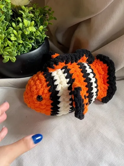 This handmade clownfish is ready to swim into your heart. It's a great toy for encouraging imaginative play about the ocean.