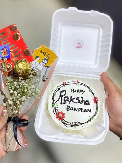 No Rakhi is complete without a sweet surprise. Our 2025 Rakhi edition hamper with a bento cake and a mini bouquet.