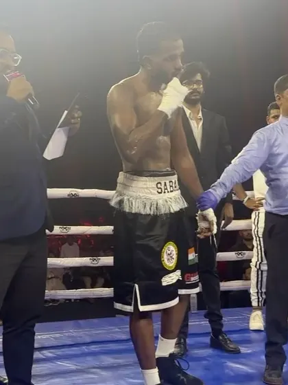 The referee raises the hand of the new WBC Middle East Welterweight Champion.