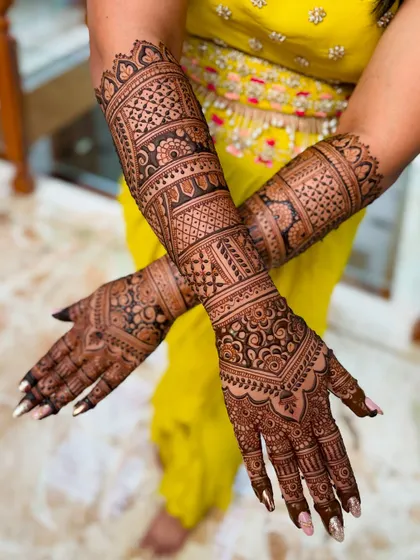 A full-coverage bridal design with intricate geometric and floral patterns, perfect for a bride who loves detail.